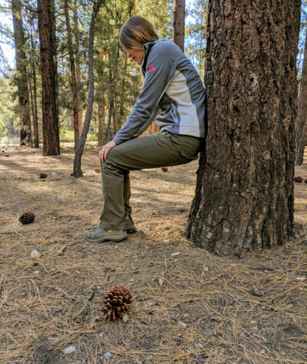 leaning against tree